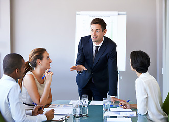 Image showing Meeting, presentation and businessman in office with discussion, stats or speaker at b2b workshop. Teamwork, management and business people in conference room brainstorming ideas, planning and review