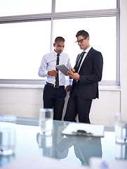 Image showing Business men, tablet and discussion on plan for project, office and collaboration on idea. Colleagues, teamwork and internet for online research, partnership and communication in meeting for support