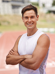 Image showing Athlete, portrait and happy for fitness on stadium, commitment and wellness of sprinting professional. American, man and face with smile for confident in sport, outdoor and training for health body