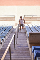 Image showing Stairs, running and man with training, exercise and cardio with wellness and healthy with sunshine. Person, runner and athlete with steps and summer with hobby and fitness with practice with energy