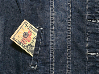 Image showing Ten american dollars in a pocket of a denim jacket