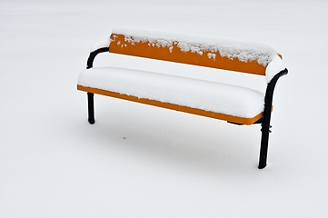 Image showing bench covered with snow, minimalist photography 
