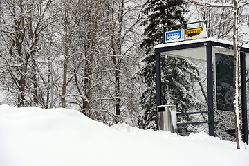 Image showing bus stop outside the city in winter