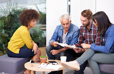 Image showing Creative, team and CEO brainstorming with paperwork, smile and happiness for employee in workplace. Collaboration, men and women in interior decoration business, discuss and plan for project