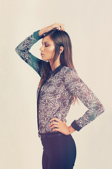 Image showing Model, fashion and profile of woman for clothes, beauty and trendy outfit with eyes closed isolated in studio background. Female person, vintage and lady with print shirt, black trousers and garments