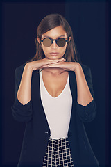 Image showing Studio, fashion and portrait of woman with sunglasses stylish for cool, edgy and trendy style with confidence. Serious, elegant and female model on black background with pride from Australia