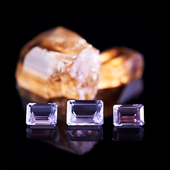 Image showing Gemstone, citrine and amethyst in studio with isolated black background for natural resource, jewel and sparkle for luxury. Rock, crystal and reflection in closeup for shine, glow and mineral