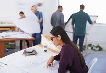 Image showing Serious woman, architect or blueprint at desk for planning construction project, building or development in startup office. Creative, design or professional engineer on sketch, paper or check drawing