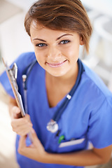 Image showing Woman, nurse and happy portrait with clipboard in medical office, nutritionist and stethoscope, professional nursing career. Results, healthcare and medic for wellness in uniform for surgery