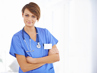 Image showing Smile, arms crossed and portrait of nurse in hospital for support, healthcare and life insurance. Woman, scrubs and stethoscope with pride for confidence, wellness and medical service at clinic