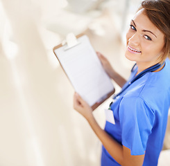 Image showing Happy woman, portrait and nurse with clipboard above for life insurance, policy or medical prescription at hospital. Top view of female person or scrub with smile, document or paperwork for checklist