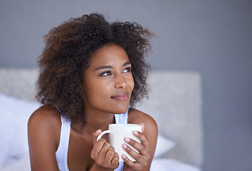 Image showing Black woman, face and thinking with coffee in bed for morning, vision or memory in comfort at home. Young African female person with afro in wonder or thought with beverage or drink in the bedroom