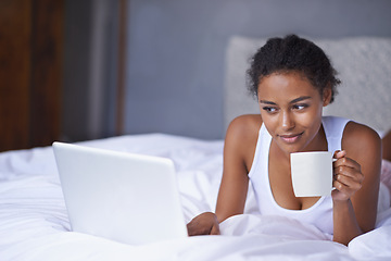 Image showing Black woman, laptop or coffee in bed to relax, scroll or search on internet, social media or network. Female influencer, tea or smile as checking, message or email for viral meme and blog post