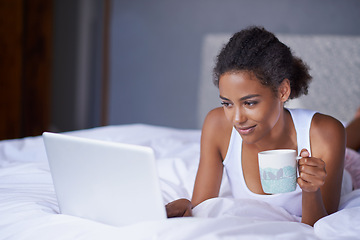 Image showing Black woman, computer or tea in bed to relax, scroll or search on internet, social media or network. Female influencer, coffee or laptop as checking, message or email for viral meme and blog post
