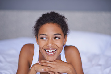 Image showing Woman, happy and relax in bedroom in home, inspiration and positive on morning vacation. Young lady, smile and wellness on break on lazy weekend, duvet and pyjamas in cozy bed in modern apartment