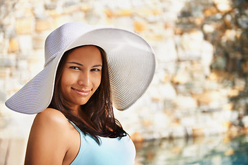 Image showing Smile, sun hat and portrait of woman at resort for summer holiday, travel and break by pool. Relax, happy and female person with happiness for vacation, weekend trip or luxury retreat for wellness