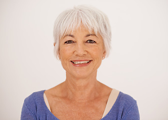 Image showing Happy, smile and portrait of elderly woman with closeup, confidence and natural for fashion isolated on white background. Mature lady, female person and face for casual, apparel and trendy in studio