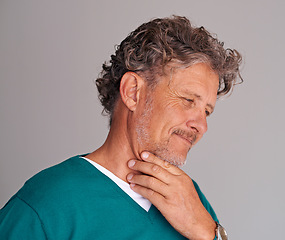 Image showing Mature man, thinking and confused in studio, question and choice or decision on gray background. Male person, contemplating and planning for wellness in retirement, doubt and unsure on mockup space