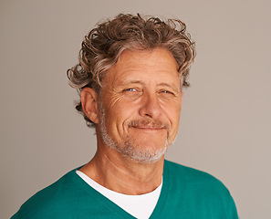 Image showing Mature man, portrait and happy in studio, peace and confidence for wrinkles on brown background. Male person, positive face and proud of wellness or health, smile and satisfaction on mockup space