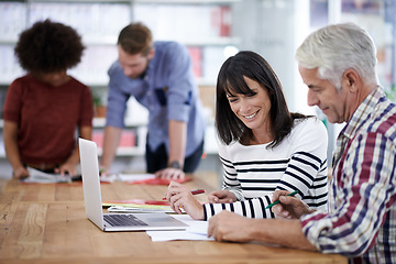 Image showing Business people, discussion and laptop in office with colleagues, teamwork and document for working. Collaboration, professionals and brainstorming for project or career in meeting or workplace