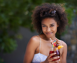 Image showing African, woman and portrait with cocktail and sunglasses or summer vacation, relax or happy for wellness at resort. Holiday, tropical retreat or natural black female person, fruit liquid for drinking