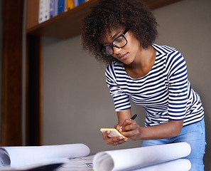 Image showing Woman, home and writing on notepad with plans, business and remote work from living room. Strategy, architect and African female person serious and concentrated for architecture by black worker