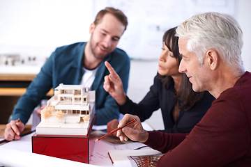 Image showing Architect , collaboration and planning with building model, 3d design and development with colleagues. Remodeling, construction and people pointing in meeting, contractor or developer for project