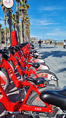 Image showing BARCELONA, SPAIN - APRILL 2, 2024: Row of red bikes parked