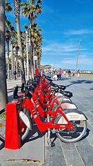 Image showing BARCELONA, SPAIN - APRILL 2, 2024: Row of bikes parked on sidewalk