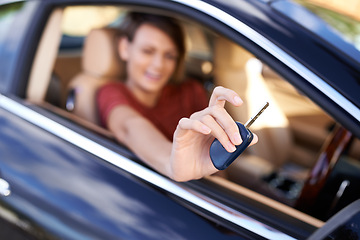 Image showing Lets take this for a spin. Closeup shot of a woman sitting in a car holding the keys up to the camera.