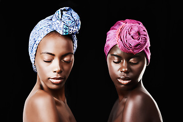 Image showing Black women, head wrap and relax portrait with beauty, skincare and natural cosmetics in studio. Traditional, turban and African fashion with wellness and skin glow with makeup and dark background