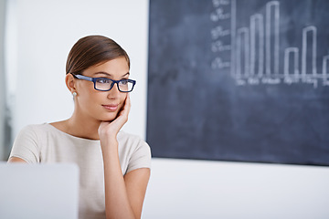 Image showing Teacher, woman and laptop by blackboard with thinking in classroom, smile and planning with idea. Person, computer and vision for course design, lesson and research for education, learning and school