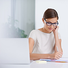 Image showing Businesswoman, laptop and writing notes for planning, inspiration and schedule agenda in office. Female person, administration and online calendar for tasks, receptionist and journal for information