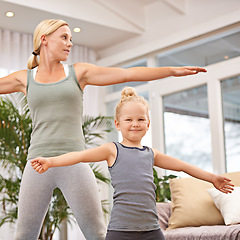 Image showing Yoga, exercise with mother and child in living room, stretching out arms for balance and bonding. Woman, young girl and fitness together at family home, health and wellness with love and care