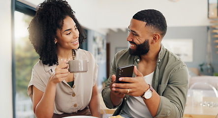 Image showing Couple, happy and coffee with smartphone for social media, sharing music or app explanation. Man, woman and technology in kitchen with breakfast for morning, relaxing and scrolling on online website