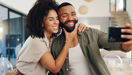 Image showing Home, selfie and couple with love, funny and smile with happiness and social media in a living room. Apartment, man and woman in a lounge, profile picture and humor with laughing and bonding together