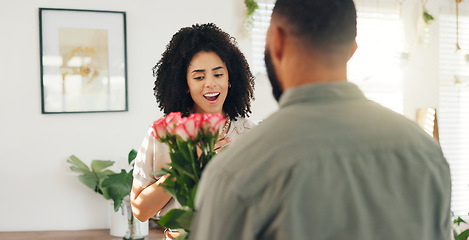 Image showing Couple, hug and flowers as surprise for valentines day with love bouquet or relationship, anniversary or behind. Man, woman and embrace in home with roses for marriage or date, celebration or present