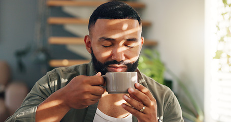 Image showing Smile, calm and man with coffee by window in apartment for relaxing weekend morning routine. Happy, peace and young male person drinking cappuccino, tea or latte in cup with aroma at modern home.