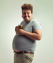 Image showing Obesity, weight gain and lager for man in studio with drink for unhealthy habit, plus size and joke. Overweight person with glass on fat stomach for balance, drunk and humor for alcohol and comic