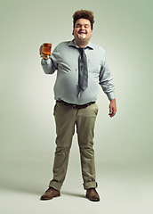 Image showing Man, portrait and drinking with beer foam in party or obesity on a studio background. Young male person or plus size model with glass, mug or alcohol in satisfaction for wine or booze on mockup space