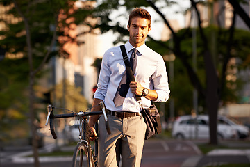 Image showing Bicycle, city and portrait of businessman in morning for travel, commute and walking to work. Professional, urban town and happy person with bike for cycling, sustainable and eco friendly transport