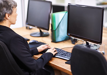 Image showing Business woman, computer and typing in an office with email, blank monitor and internet at company. Desktop, professional and female person with technology of website manager at a desk with worker