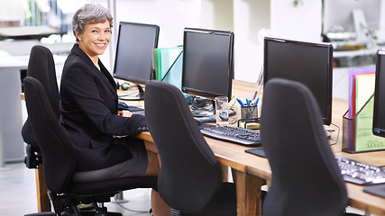 Image showing Senior, business woman and portrait with computer at agency for communication or networking at office. Mature female person, agent or employee with smile on desktop PC for customer service or support