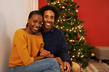 Image showing Couple, portrait and Christmas holiday at tree in home or vacation connection for festive season, love or decoration. Man, woman and face with lights in winter or marriage celebration, relax or break