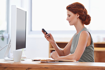 Image showing Business woman, phone and reading or typing at office desk for social media, communication or network. Professional worker, employee or person in public relations with mobile for chat and check email