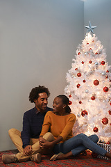 Image showing Couple, Christmas and tree in apartment for holiday celebration for winter season, decoration or bonding. Man, woman and happy in home for present giving in America for event, connection or together