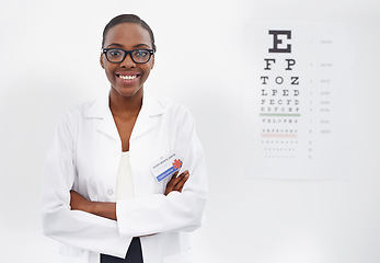 Image showing Test, vision and portrait of woman in consultation for optometry, eye exam and doctor in healthcare. Glasses, expert and medical chart with letters in clinic and African optometrist with spectacles