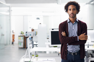 Image showing Portrait, businessman and arms crossed in office for confidence and commitment to career. Man, face and pride in job with satisfaction in workplace, ambition and IT professional to work with computer