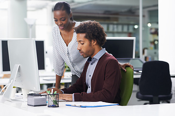 Image showing Coworker, computer and desk in office for research, collaboration or career in company for work or profession. Intern or employee with mentor and tech for internet, help or guide for online indoor