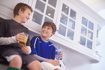 Image showing Kitchen, team and boys with smile for drinks, soccer or football and practice for match with ball. Friends, children and kids ready in house for workout, exercise and training to play sport for game